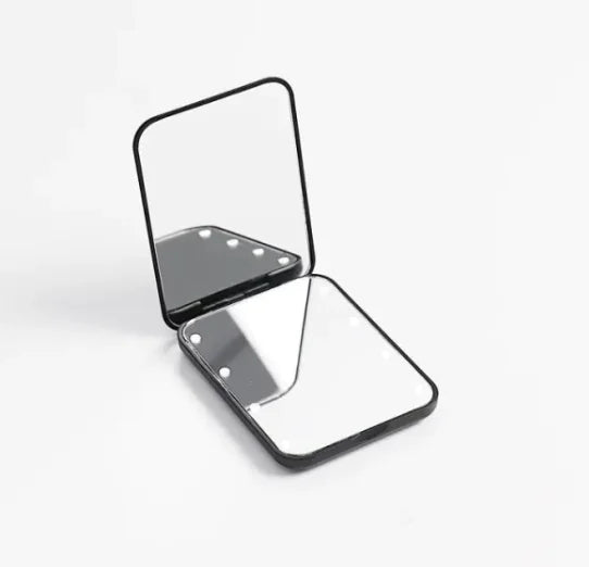 GlowFold LED Makeup Mirror – Portable travel setup with mirror open